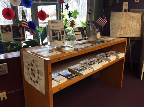 Photo of a table that has pamphlets and brochures on it regarding citizenship.