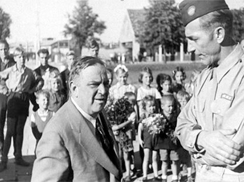 UNRRA Director General Fiorello LaGuardia converses with an unidentified official during a visit to he Neu Freimann displaced persons camp, 1946. United States Holocaust Memorial Museum, courtesy of Saul Sorrin.