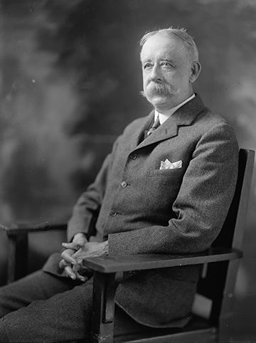 Photo of Commissioners Richard K. Campbell sitting in a chair